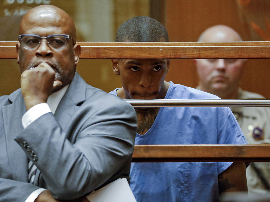This April 4, 2019 file photo shows Eric Holder, the suspect in the killing of rapper Nipsey Hussle, in Los Angeles County Superior Court with his attorney Christopher Darden. 