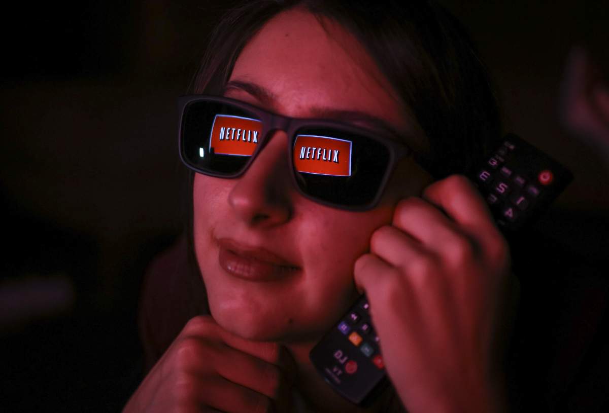 Netflix logo is reflected on a woman’s eyeglasses in Ankara, Turkey on Nov. 27, 2018.