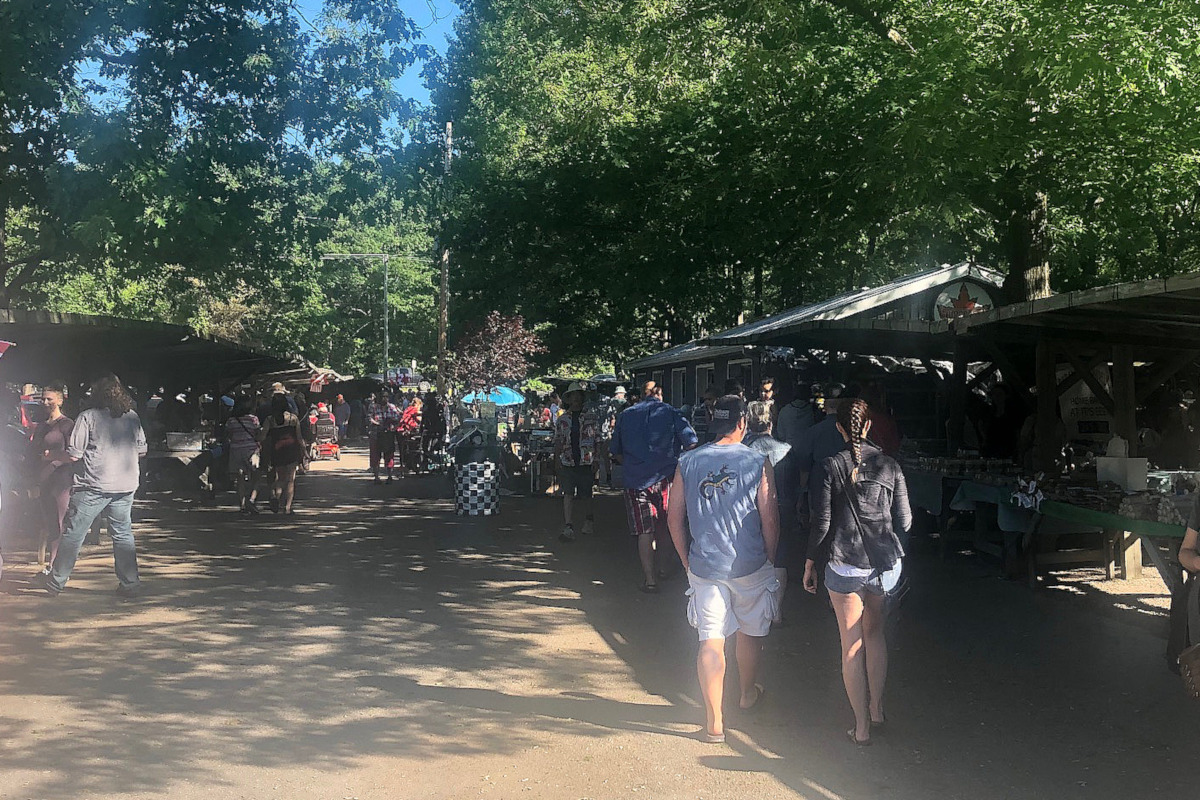 Visitors wander through the Pinery Antique Flea Market in Grand Bend, Ont.