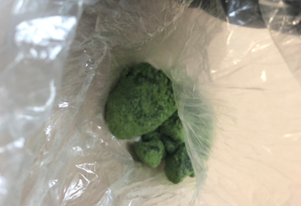 Guelph police say officers found green fentanyl while making two arrests on Tuesday night.