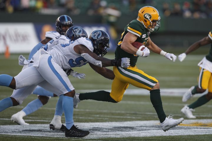 Toronto Argonauts chase Edmonton Eskimos Greg Ellingson (82) during first half CFL action in Edmonton, Alta., on Thursday July 25, 2019. 