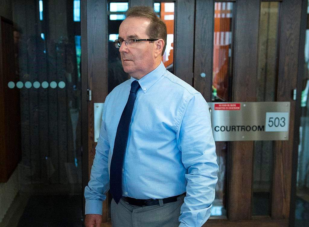 Glen Assoun, the Nova Scotia man who spent almost 17 years in prison for a crime he didn't commit, stands outside Supreme Court in Halifax on Friday, July 12, 2019. A judge had ordered the full release of a federal Justice Department report that led to the exoneration of Assoun, wrongfully convicted of murder. THE CANADIAN PRESS/Andrew Vaughan.