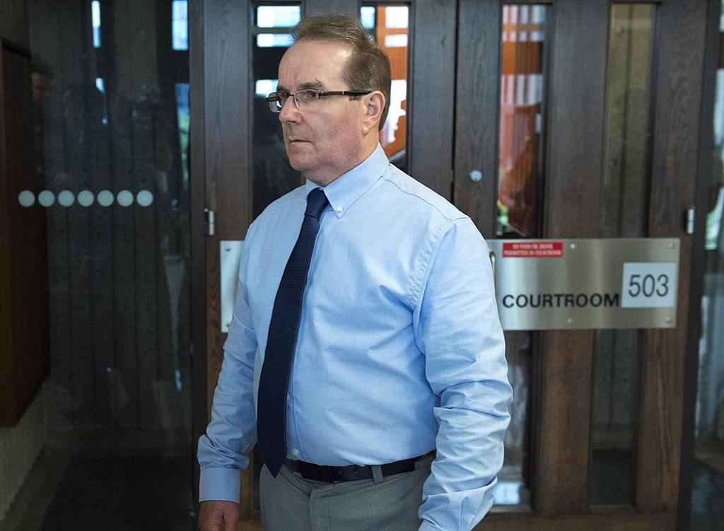 Glen Assoun, the Nova Scotia man who spent almost 17 years in prison for a crime he didn't commit, stands outside Supreme Court in Halifax on Friday, July 12, 2019. A judge had ordered the full release of a federal Justice Department report that led to the exoneration of Assoun, wrongfully convicted of murder. THE CANADIAN PRESS/Andrew Vaughan.