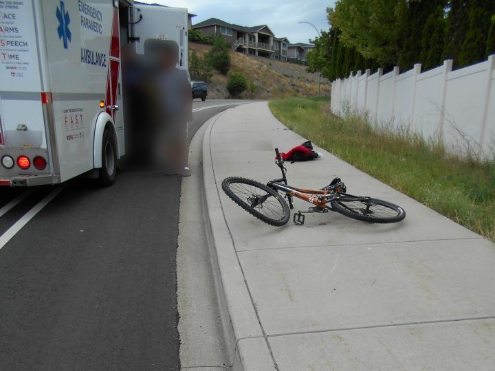 A damaged bicycle lays on the sidewalk beside Clifton Road after an alleged hit-and-run incident.