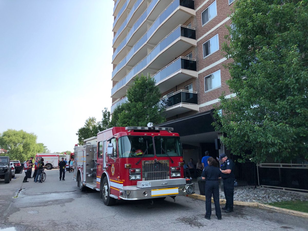 Fire crews are helping residents gather their belongings from 940 Commissioners Rd. E. after a pipe burst, causing flooding and forcing an evacuation of the highrise.