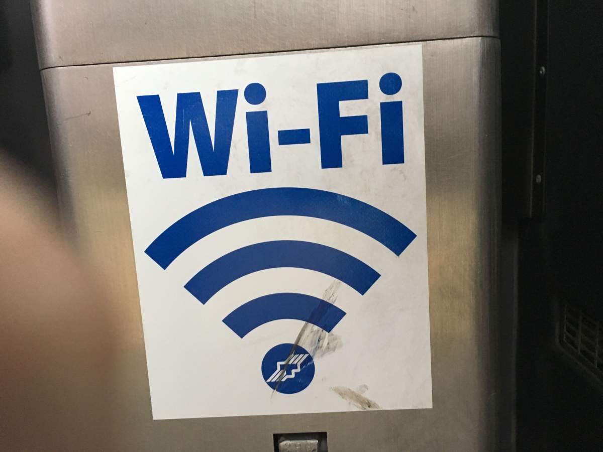 A free wifi sign on a Winnipeg Transit bus.
