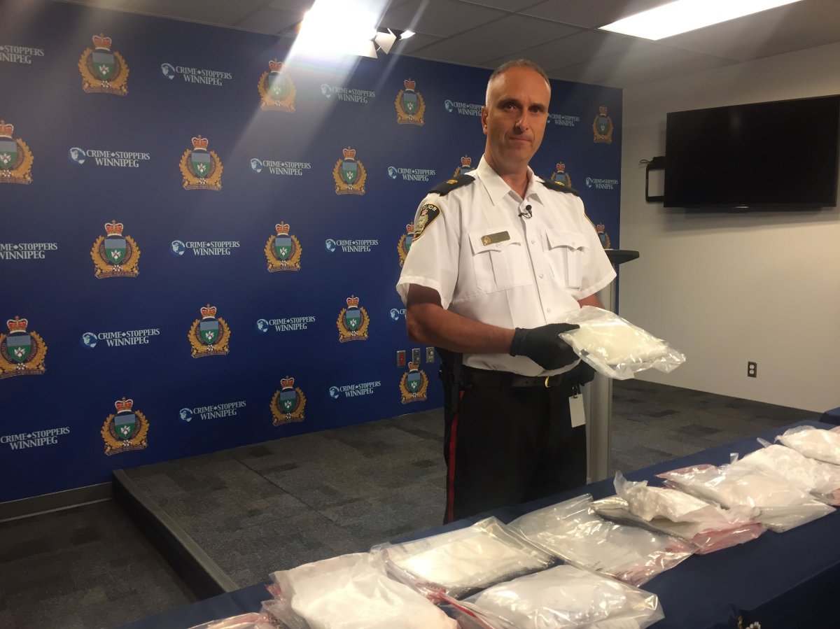 Insp. Max Waddell with a haul of drugs that included cocaine, purple heroin and methamphetamine.