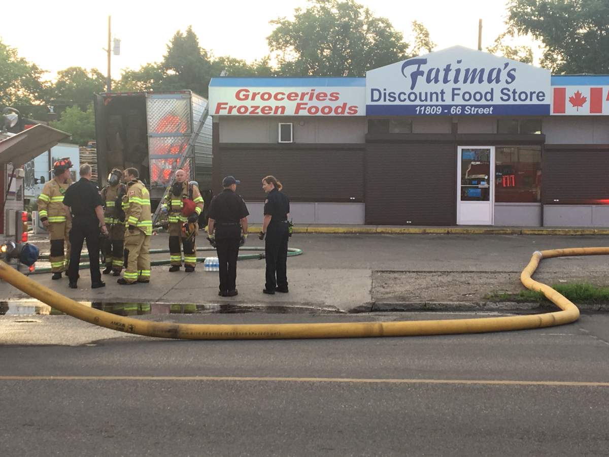 Edmonton firefighters putting out a fire at Fatima’s Discount Food Store (11816 66 St.) on Monday, July 15, 2019.