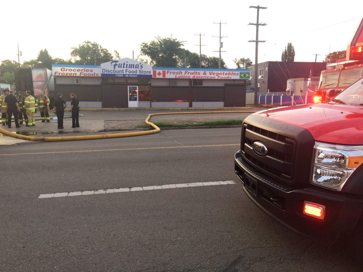 Edmonton firefighters putting out a fire at Fatima’s Discount Food Store (11816 66 St.) on Monday, July 15, 2019.