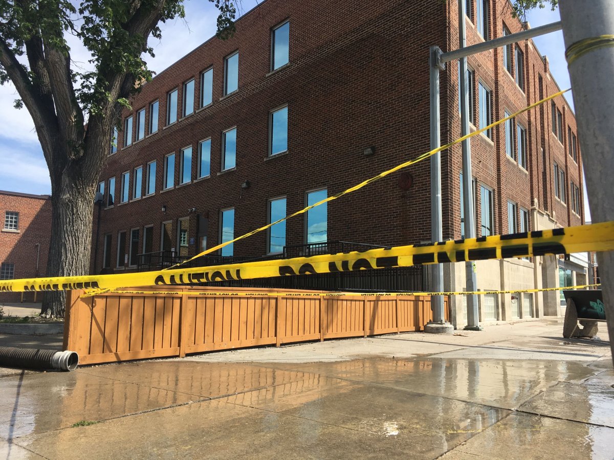A building in the 1000 block of Portage Avenue taped off as crews clean up a flood that took place early Monday morning.