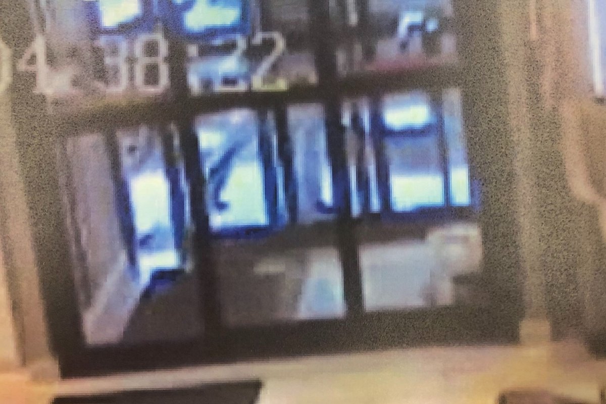 Surveillance footage shows the shooter outside the front entrance of the Comfort Inn, moments after Aly Sunderani was shot and killed on March 1, 2016. 