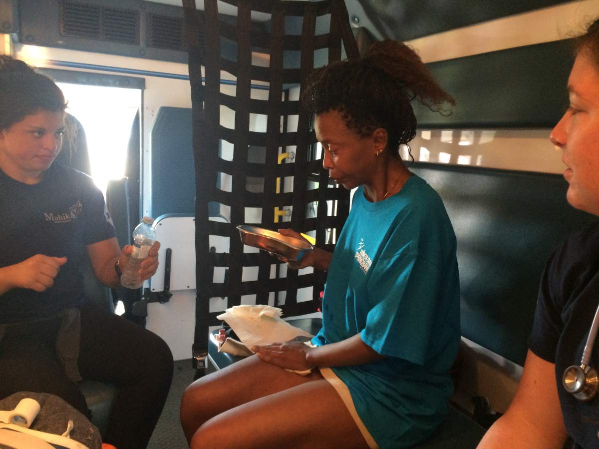 Cecilia in the back of an ambulance.