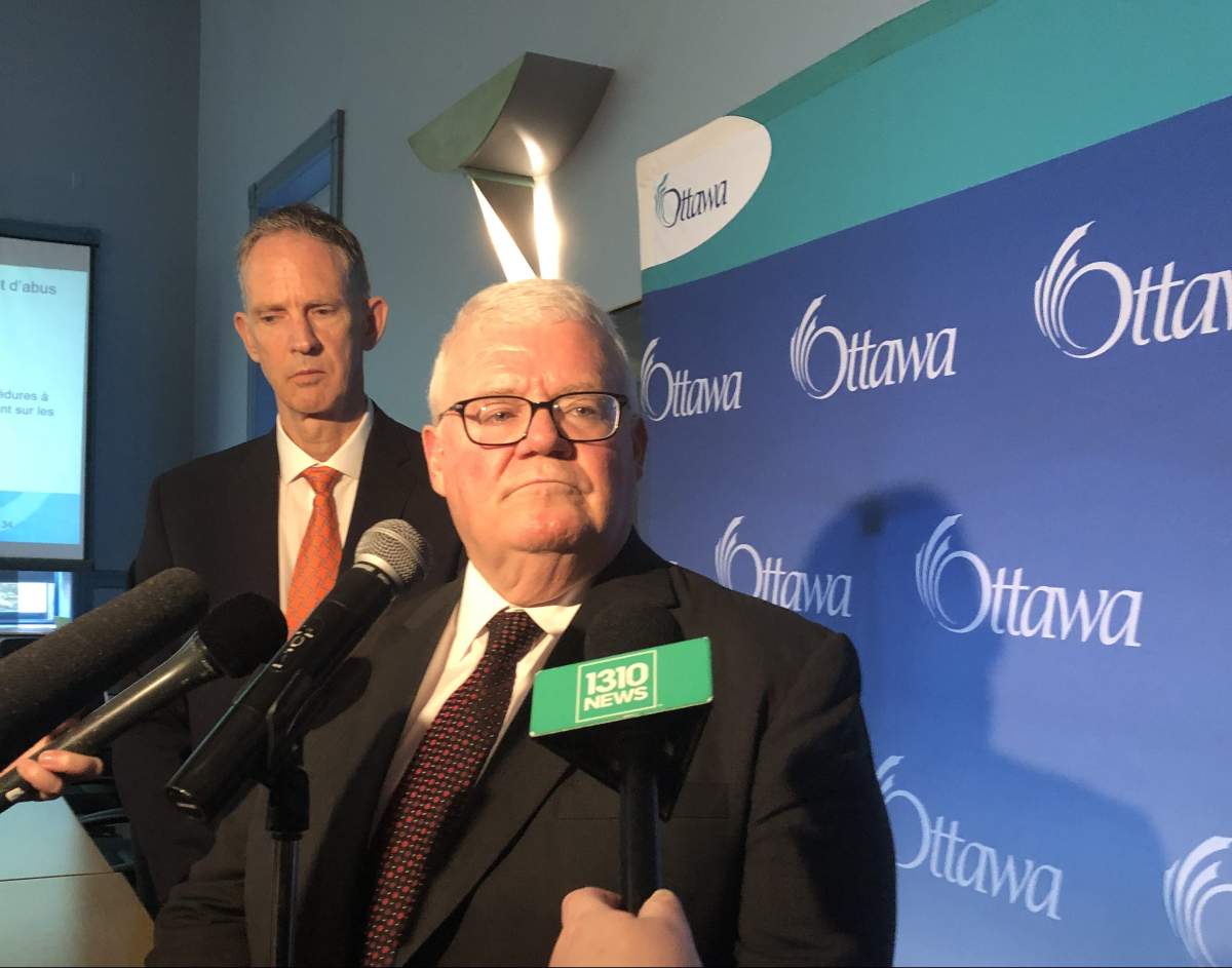 Ken Hughes, auditor general for the City of Ottawa, scrums with reporters at city hall on July 4, 2019, after tabling his annual report on cases reported to the municipality's fraud and waste hotline.