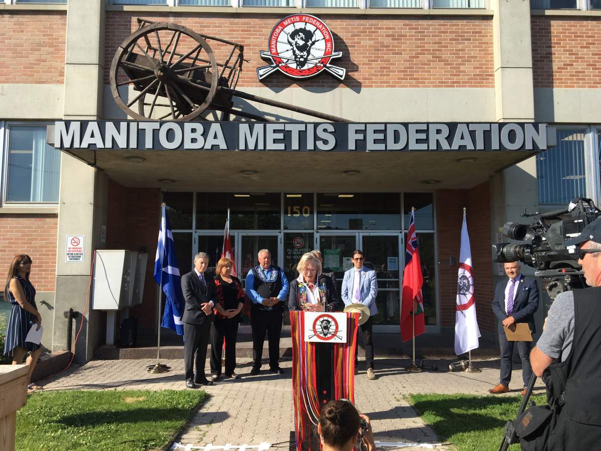 Minister of Crown-Indigenous Relations and Northern Affairs, Carolyn Bennett speaks in front of the Manitoba Métis Federation offices.