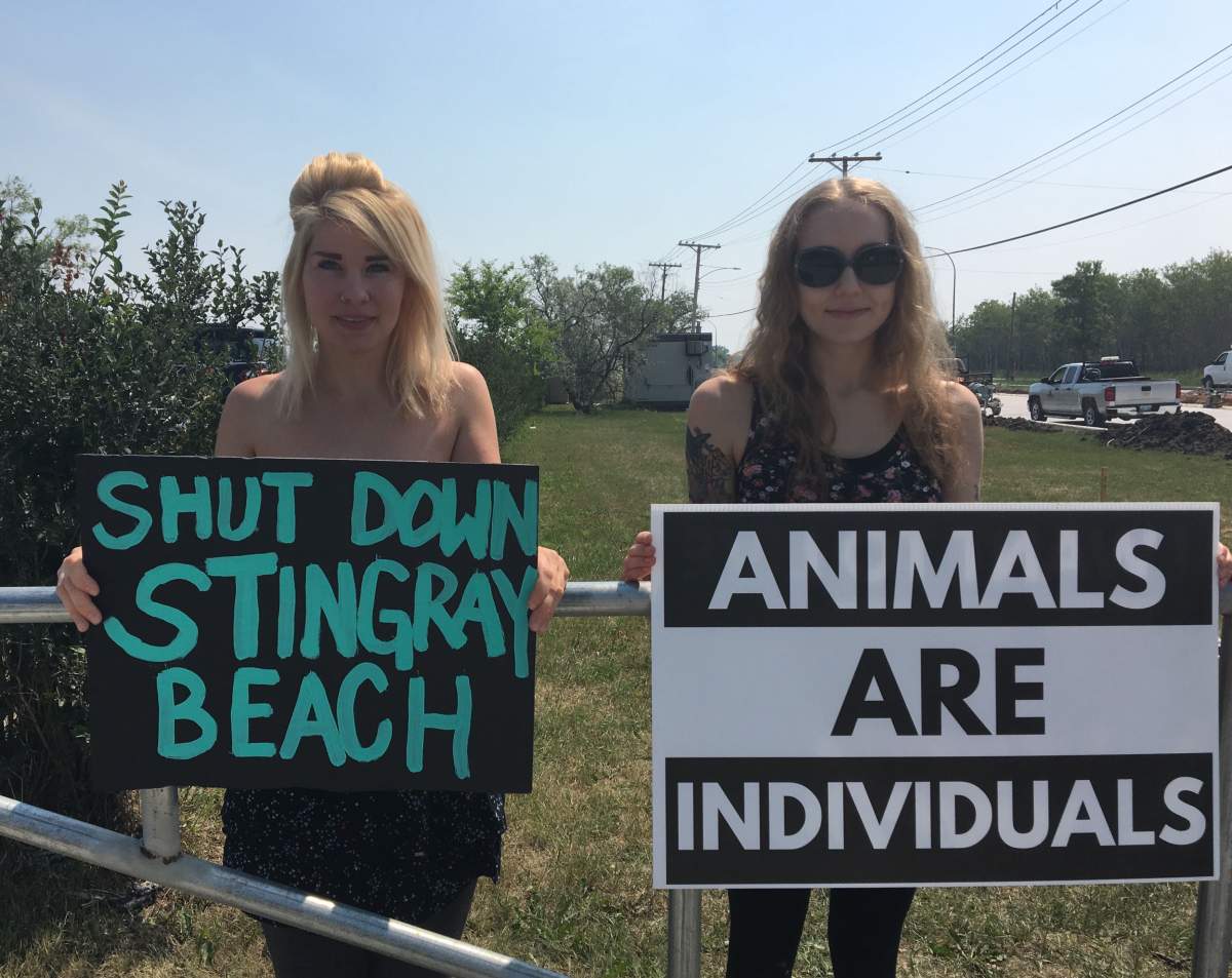 Danae Tonge (Left) standing outside the Assiniboine Park Zoo’s main parking lot on Saturday.