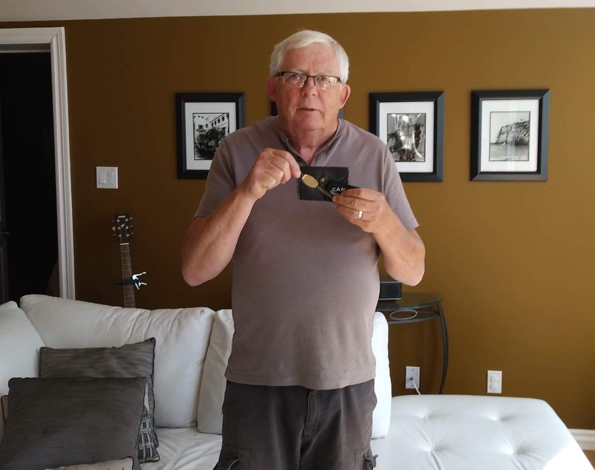 John Scott clutches the black leather pouch and its contents. He is searching tirelessly for the family linked to the pieces.