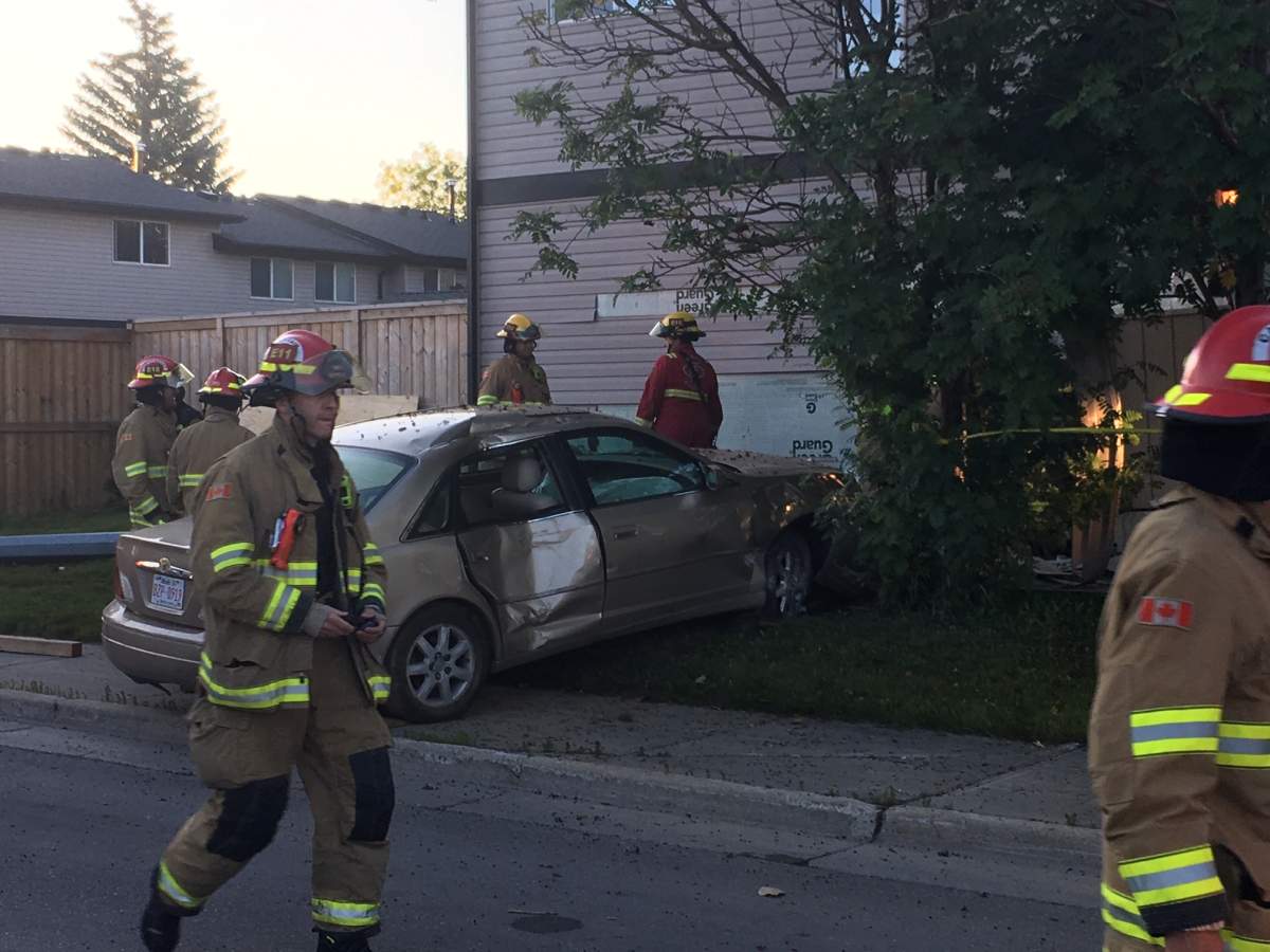 Charges pending after vehicle crashes into northeast Calgary condo ...