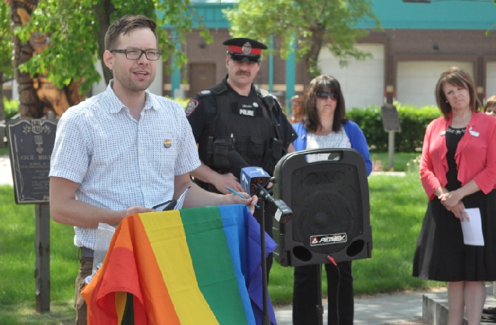 Wickenhauser speaks at a pride flag-raising ceremony.