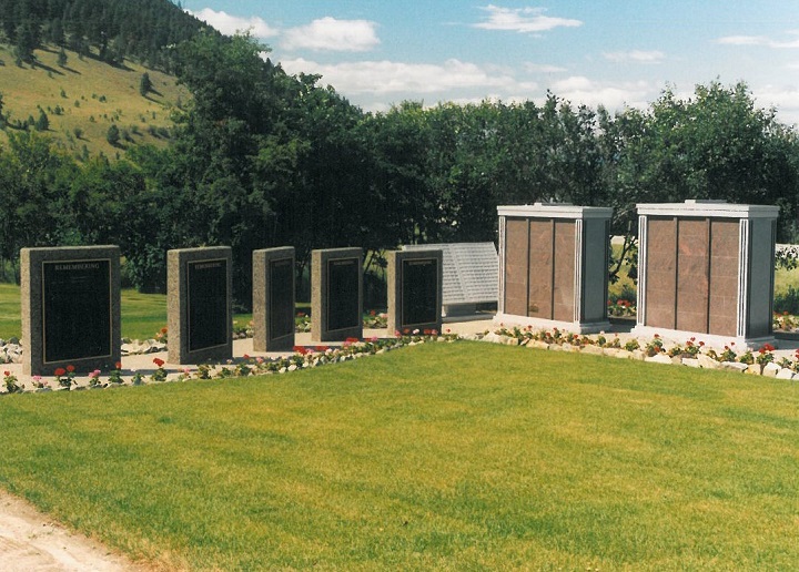A photograph taken at Lakeview Memorial Gardens cemetery in Kelowna, which show five bronze memorial plaques affixed to stone walls on the left. Four of the plaques were stolen earlier this week.