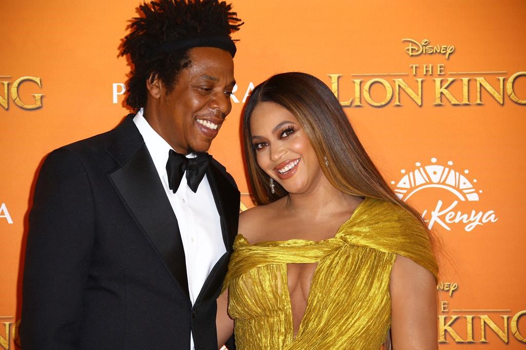 Singers Jay-Z, left, and Beyonce pose for photographers upon arrival at the ‘Lion King’ European premiere in central London, Sunday, July 14, 2019.