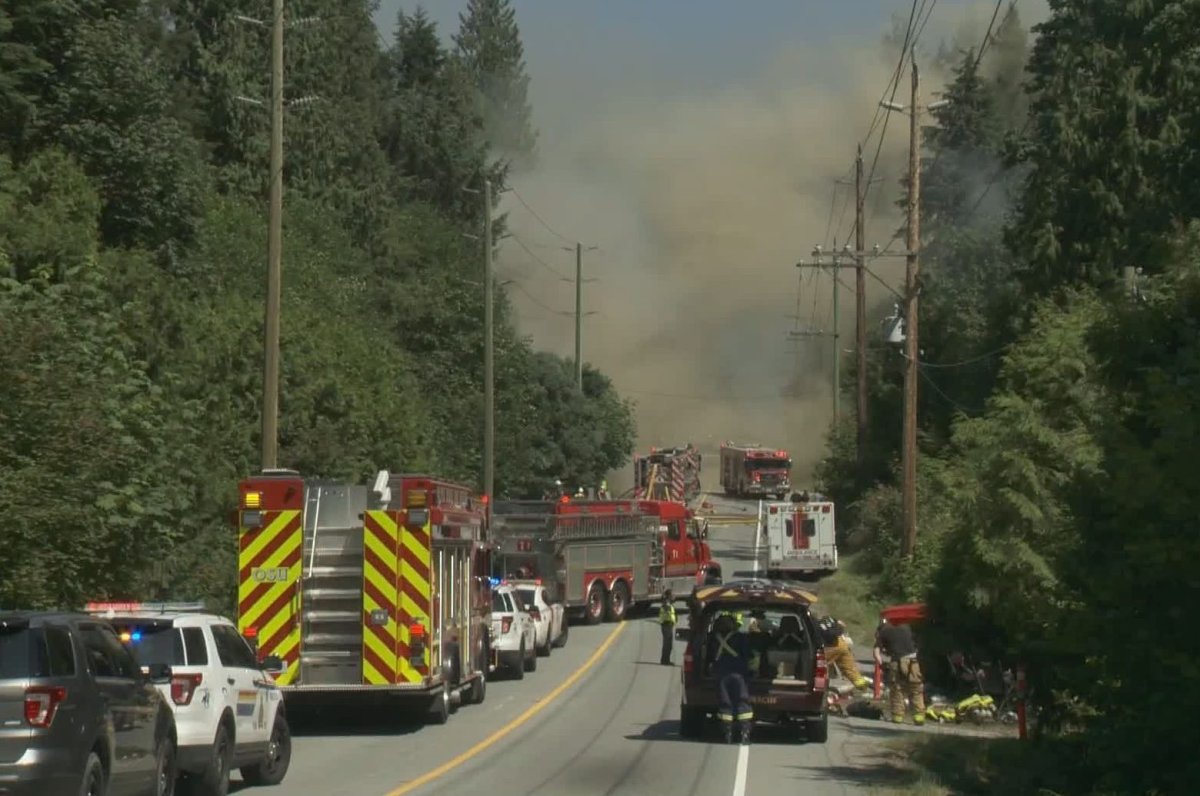 Smoke billows from an engulfed Maple Ridge home where one person was killed on Saturday, July 20, 2019.