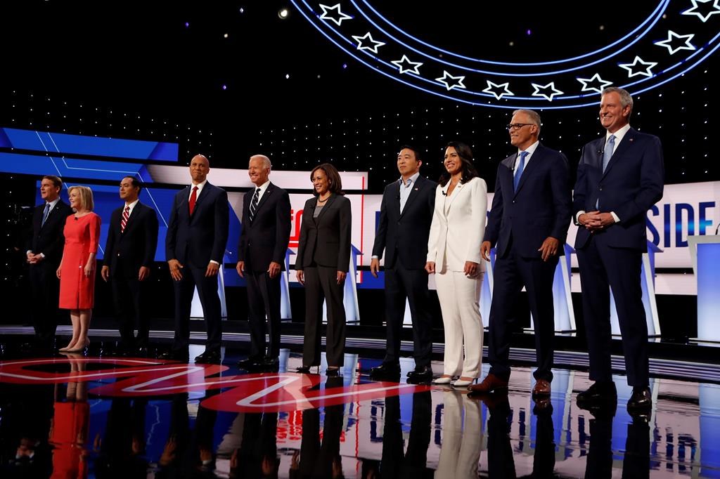 (L-R) Sen. Michael Bennet, D-Colo., Sen. Kirsten Gillibrand, D-N.Y., former Housing and Urban Development Secretary Julian Castro, Sen. Cory Booker, D-N.J., former Vice President Joe Biden, Sen. Kamala Harris, D-Calif., Andrew Yang, Rep. Tulsi Gabbard, D-Hawaii, Washington Gov. Jay Inslee and New York City Mayor Bill de Blasio are introduced before the second of two Democratic presidential primary debates hosted by CNN Wednesday, July 31, 2019, in the Fox Theatre in Detroit, Mich.