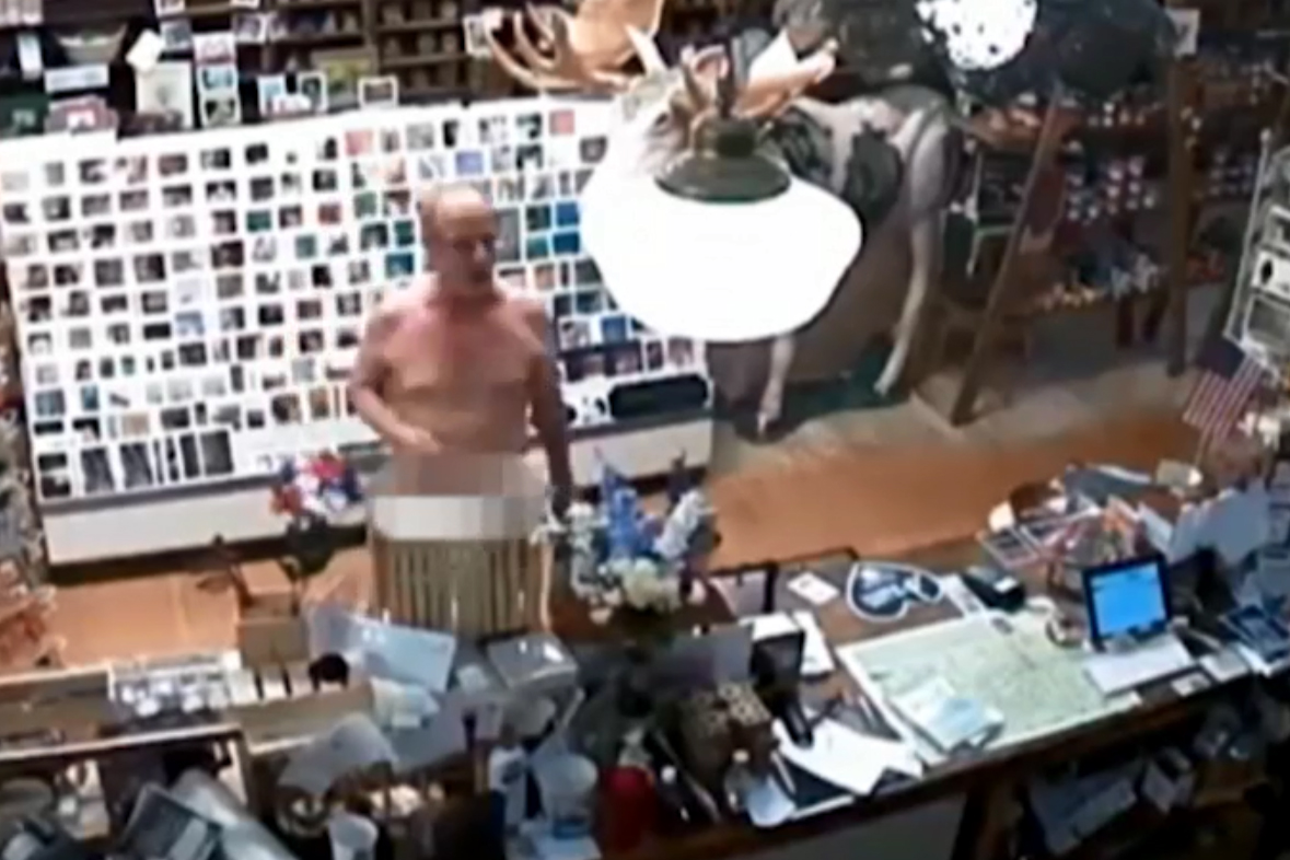 This image from security video shows a naked man at a shop in Bennington, Vt., on July 19, 2019.