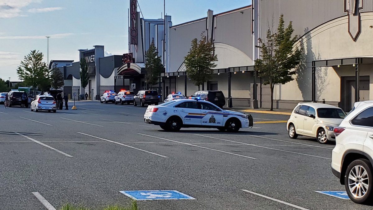 Police outside the Woodgrove Centre Mall in Nanaimo on Monday. 