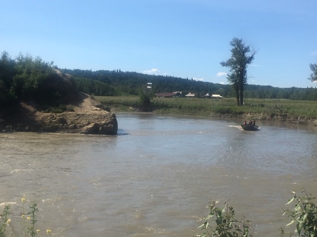 Search crews seen on the Highwood River on July 1, 2019, searching for a young Calgary man believed to have drowned over the weekend.