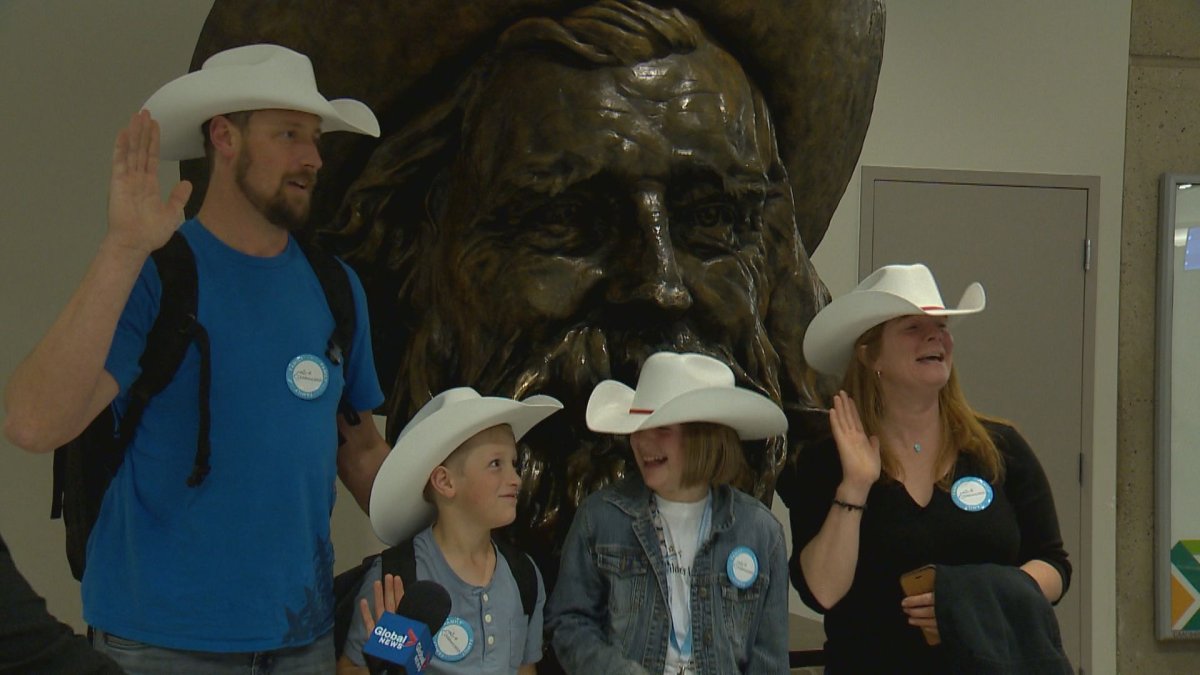 Anna Donovan-Harris and her family take the White Hat oath at YYC Calgary International Airport. 