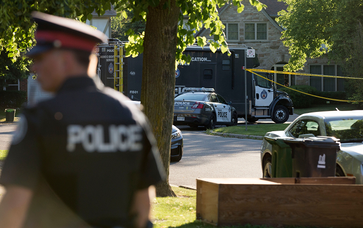 Police on scene investigating a shooting in North York on Monday. 