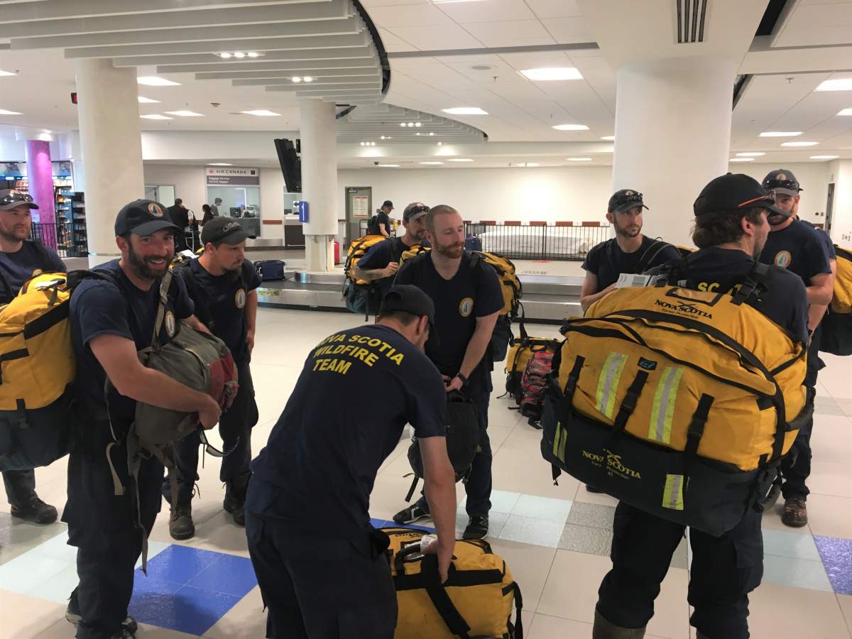 A crew of 21 Nova Scotia firefighters returned arrives at the Halifax Stanfield International Airport on July 21, 2019, after two spent battling wildfires in northwestern Ontario. 