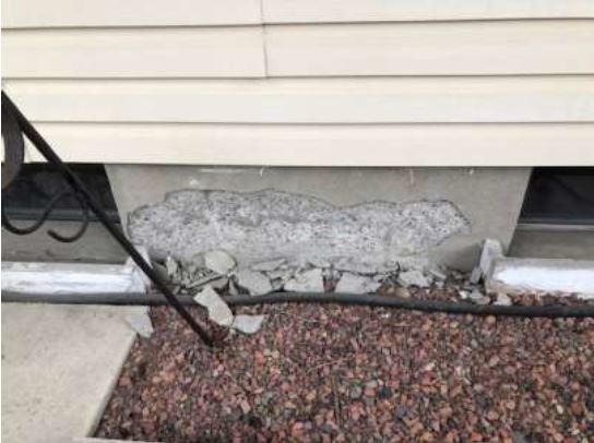 Photo of parging damage at Calgary home