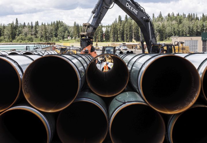 Pipe for the Trans Mountain pipeline are unloaded in Edson, Alta. on June 18, 2019.Today, Project Reconciliation announced the start of a community listening tour through B.C. and Alberta.