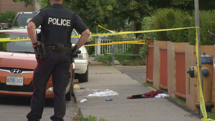 Some clothing could be seen on the sidewalk at the shooting scene.