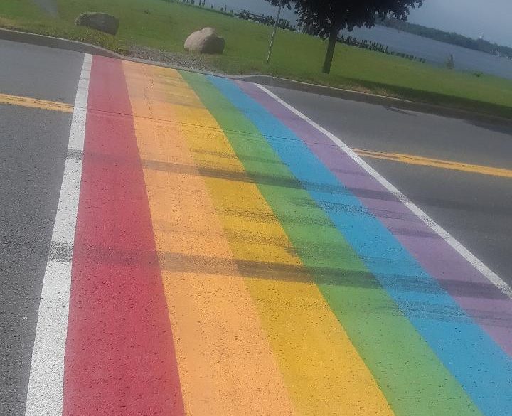 An image of tire marks that destroyed some of the colour on a newly-painted Pride crosswalk at King and Russell streets in Prescott, Ont. OPP say they've charged an eastern Ontario man who was witnessed doing "intentional burnouts" on the crossing with his truck.