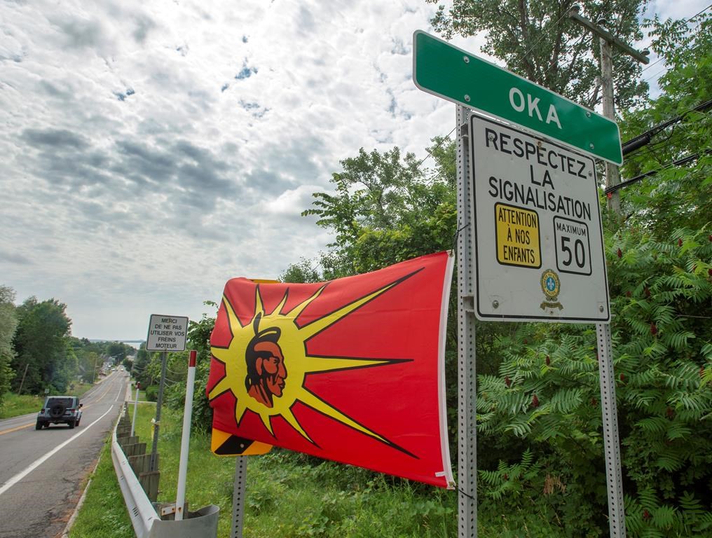 Mohawk flags are placed at the border of the Kanasatake Mohawk territory and the town of Oka Friday, July 19, 2019 in Oka, Quebec.