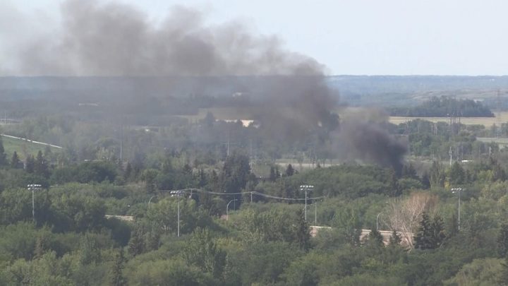 Smoke coming from a garage fire at 2001 St. Henry Ave. on July 29, 2019.