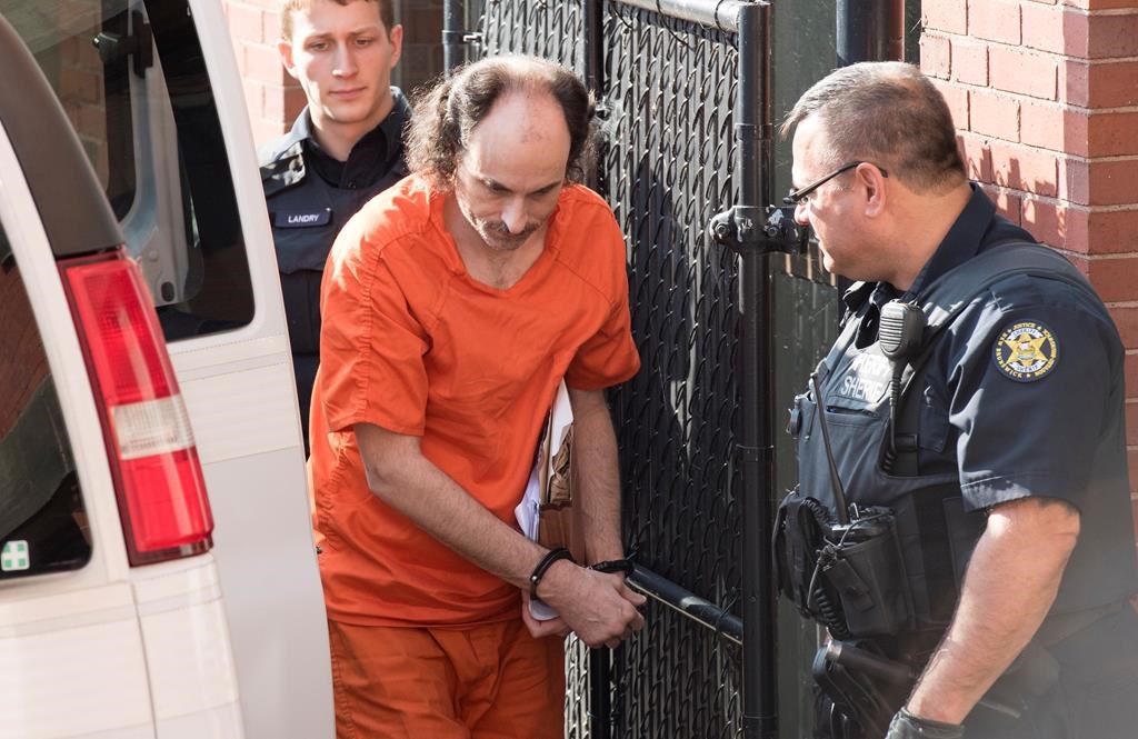 Matthew Vincent Raymond arrives at provincial court in Fredericton on Friday, July 26, 2019. Raymond is charged with four counts of first-degree murder in the deaths of Fredericton police constables Sara Burns and Robb Costello, and civilians Donnie Robichaud and Bobbie Lee Wright.