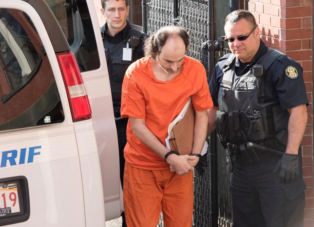 Matthew Vincent Raymond arrives at provincial court in Fredericton on Friday, July 26, 2019. Raymond is charged with four counts of first-degree murder in the deaths of Fredericton police constables Sara Burns and Robb Costello, and civilians Donnie Robichaud and Bobbie Lee Wright. THE CANADIAN PRESS/Stephen MacGillivray.