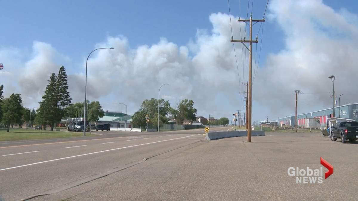 Smoke is seen in the sky near CFB Suffield as wildfires burn in Cypress County on Wednesday, July 24.