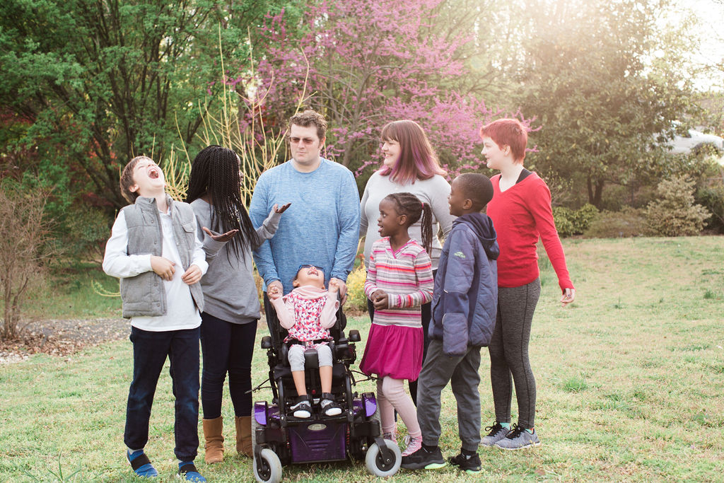 Lee Dingle, centre, is shown with his wife, Shannon, and their six children.