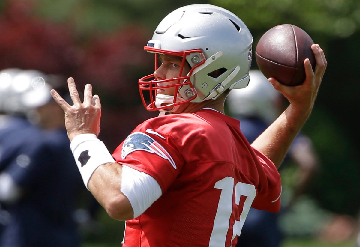 New England Patriots quarterback Tom Brady winds up for a pass during training camp in Foxborough, Mass.