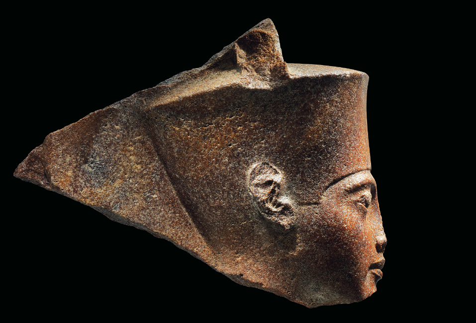 Egyptian brown quartzite head of the god Amen, with features of Tutankhamun, sold by Christie's auctioneers in the U.K.