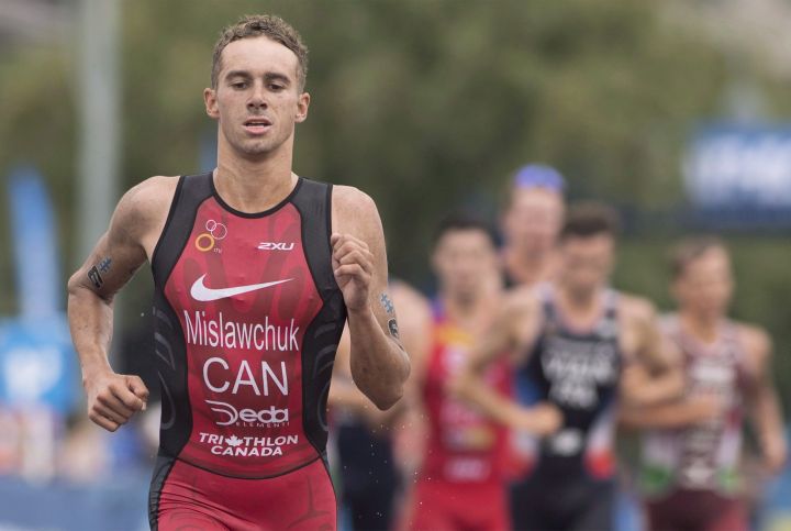 Tyler Mislawchuk of Canada competes during the ITU World Triathlon Series race in Montreal, Sunday, August 26, 2018. Mislawchuk captured his first triathlon World Cup event Saturday. 