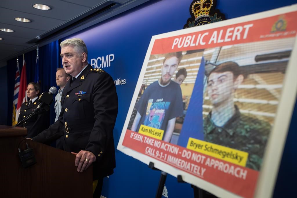 Security camera images recorded in Saskatchewan of Kam McLeod, 19, and Bryer Schmegelsky, 18, are displayed as RCMP Assistant Commissioner Kevin Hackett speaks during a news conference in Surrey, B.C., on Tuesday July 23, 2019.