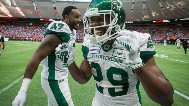 Saskatchewan Roughriders' William Powell, right, and Marcus Thigpen celebrate Powell's third touchdown during the second half of a CFL football game against the B.C. Lions, in Vancouver, on Saturday July 27, 2019.