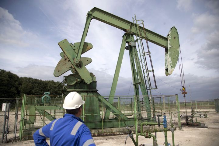A production manager for Canadian based Vermilion oil company, watches an oil rig, Wednesday, Sept. 6, 2017 in Andrezel, south east of Paris.