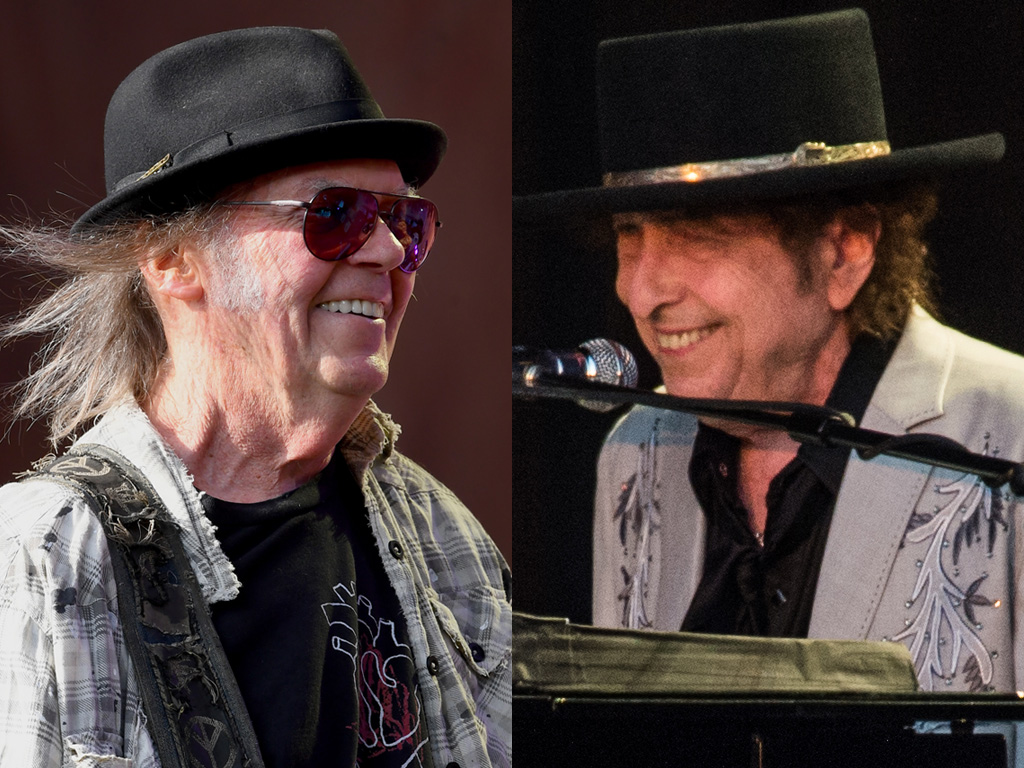 (L-R) Neil Young and Bob Dylan performing live in 2019.