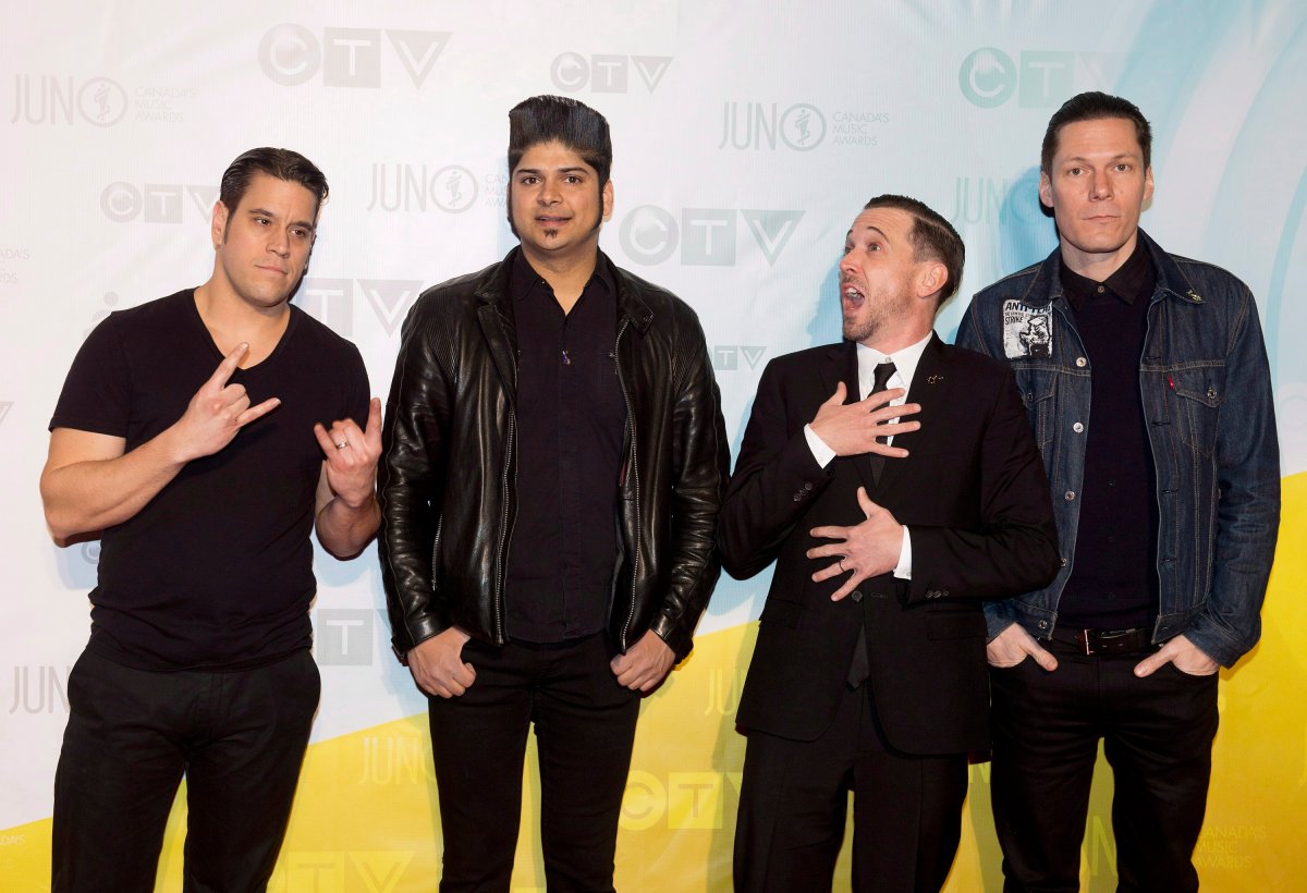 Billy Talent pose for photographs on the red carpet during the 2013 Juno Awards in Regina on Sunday, April 21, 2013. 